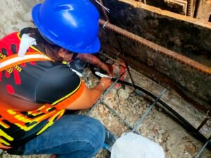termite reticulation in Bohol Jansen Pest Control Bohol technician installing a termite reticulation system for long-term termite protectio